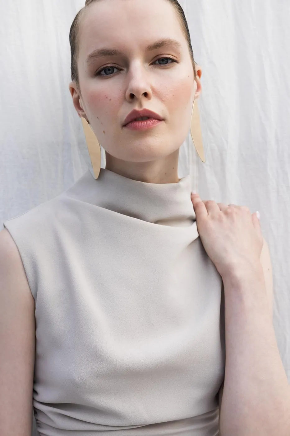 Stone Turtleneck Sleeveless Blouse